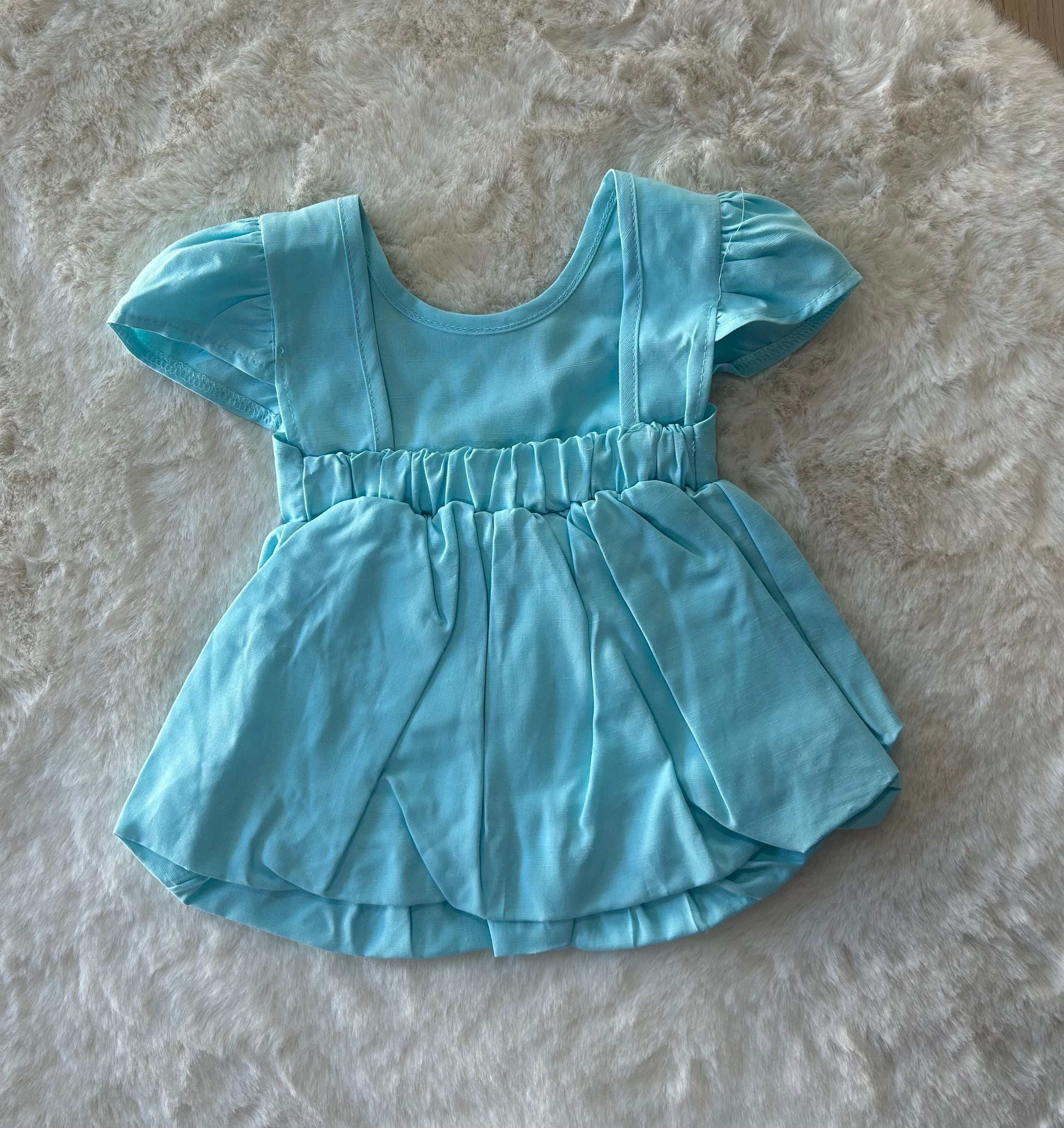 VESTITINO NEONATA CON SCOLLO ALLA SCHIENA